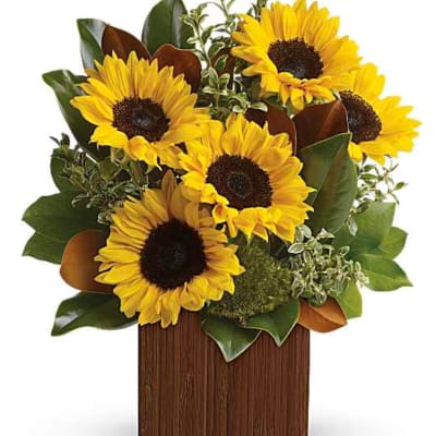 Sunflower arrangement in a tall rectangular wooden vase