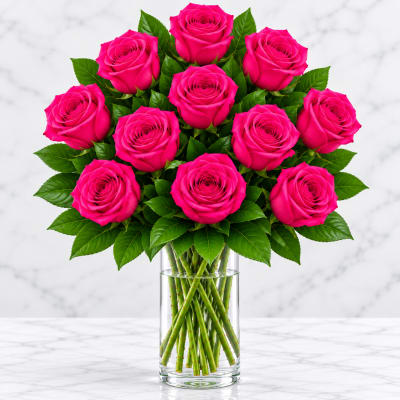 Bouquet of hot pink roses in a clear glass vase