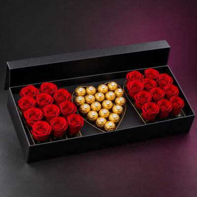 Red roses and gold chocolates arranged in a black gift box
