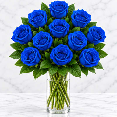Bouquet of vivid blue roses in a clear glass vase