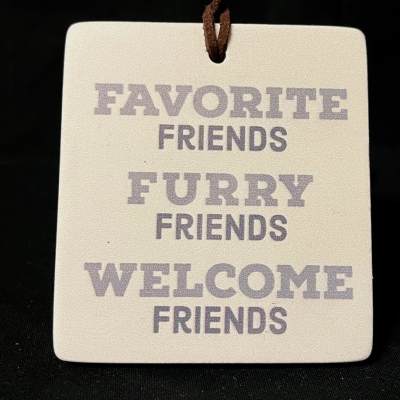 Hanging ceramic tag with the words Favorite Friends Furry Friends Welcome Friends