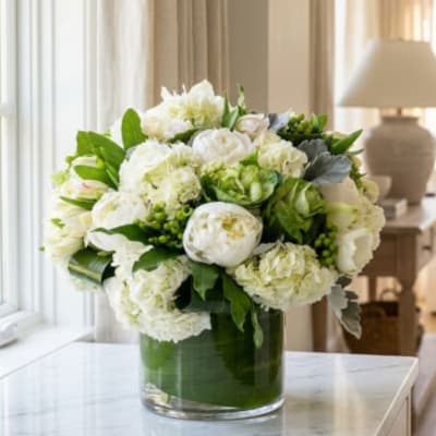 White floral arrangement in a clear glass vase