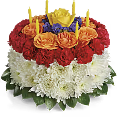 Tiered floral cake with candles in red, orange, white, and yellow blooms