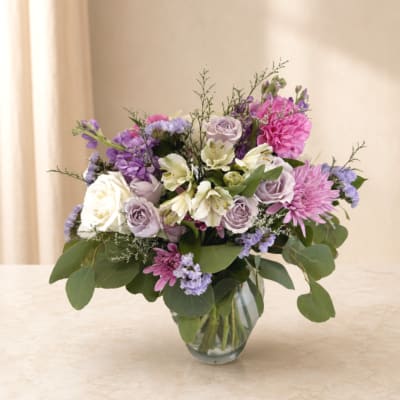 Lavender and pink mixed bouquet in a clear glass vase