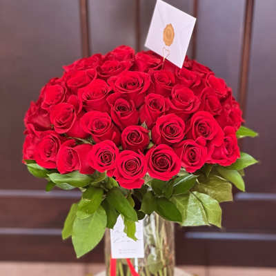 Large bouquet of red roses in a glass vase