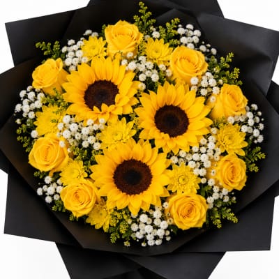 Bouquet of yellow roses and sunflowers with small white filler flowers