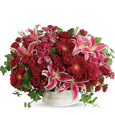 Red roses and pink lilies in a white vase