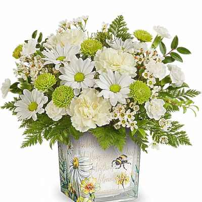 White daisies and carnations in a decorative square vase