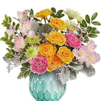 Mixed bouquet of yellow roses, pink flowers, and pale alstroemeria in a turquoise vase