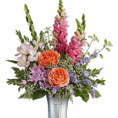 Mixed bouquet in a silver vase with orange roses and pink flowers