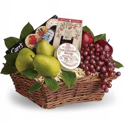 Gift basket with pears, grapes, cheese, and crackers in a wicker tray