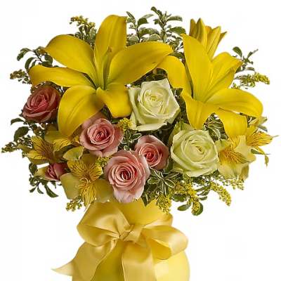 Yellow lilies and pink roses in a yellow vase with a ribbon bow
