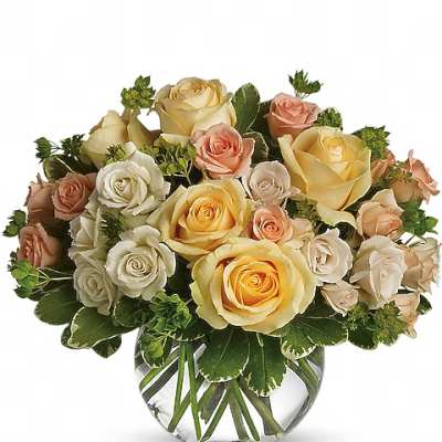 Bouquet of cream, peach, and yellow roses in a clear glass vase