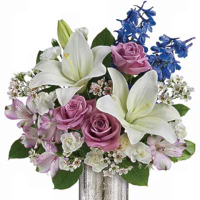 Bouquet of white lilies, pink roses, and blue flowers in a silver vase