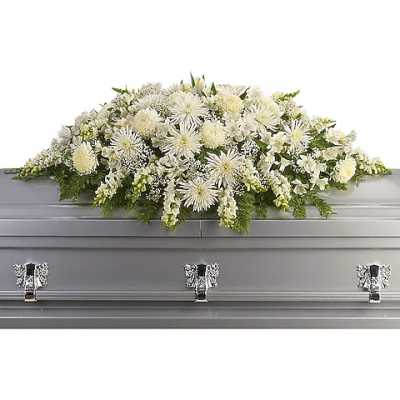 White floral casket spray with chrysanthemums and lilies