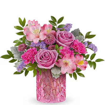 Pink roses and alstroemeria in a pink glass vase