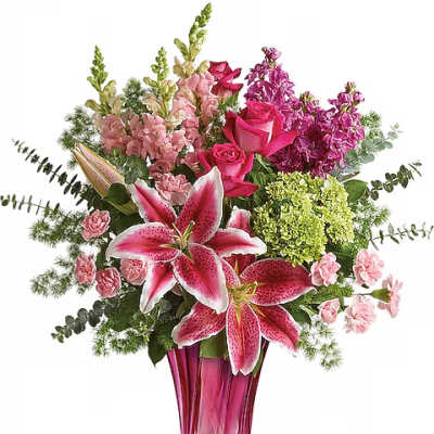 Pink lilies and roses in a tall magenta vase