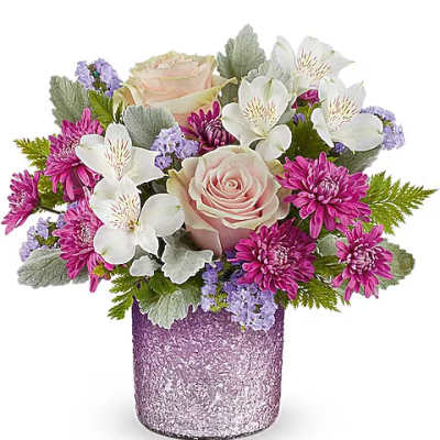 Pink roses and white alstroemeria in a glittery purple vase