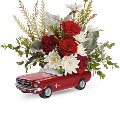 Red roses and white daisies arranged in a red toy car container