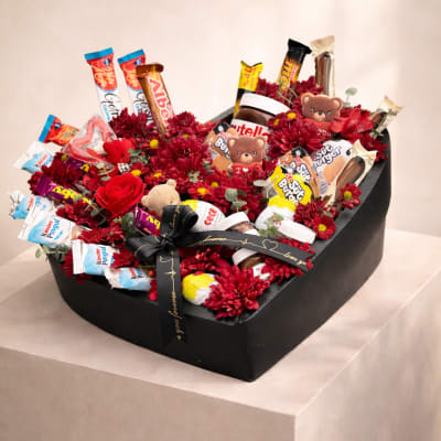 Chocolate gift box with red flowers and teddy bears
