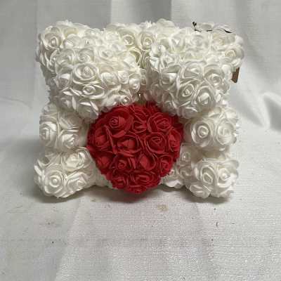 White rose teddy bear with a red heart on the front