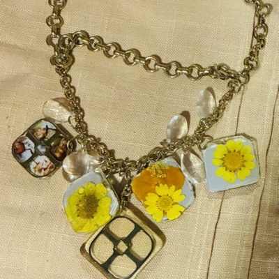 Resin and Daisy Alice in wonderland themed charm necklace