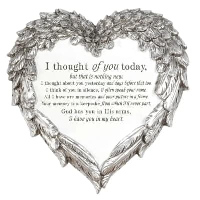 Heart-shaped silver memorial plaque with a condolence message