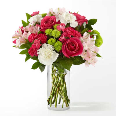 Pink and white mixed bouquet in a clear glass vase