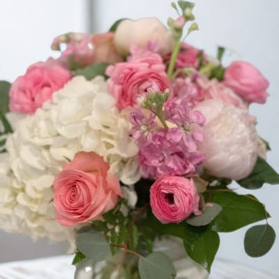 Pink and white bouquet in a glass vase