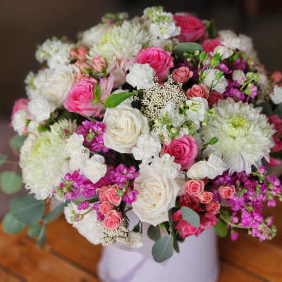 Bouquet of pink and white roses with white chrysanthemums in a vase