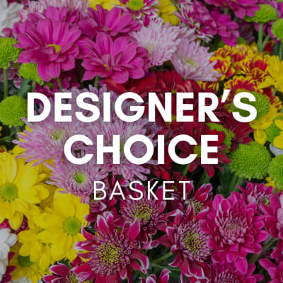 Mixed basket of bright pink, yellow, and green chrysanthemums