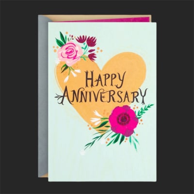 Anniversary card with a gold heart and floral accents