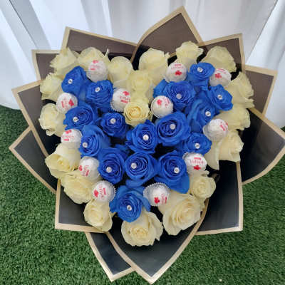 Bouquet of blue and cream roses with Raffaello chocolates