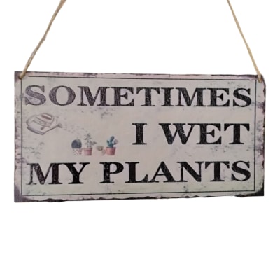 Hanging wooden sign that says "Sometimes I wet my plants"