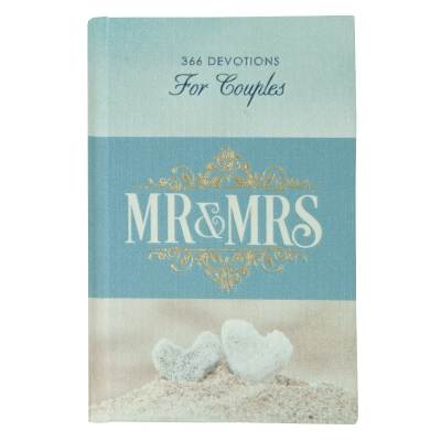 A blue book titled "MR & MRS" with two white heart stones on the cover