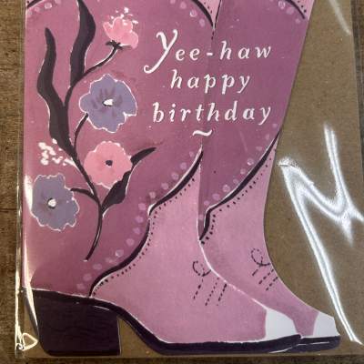 Pink cowboy boot birthday card with floral designs and 'Yee-haw happy birthday' text