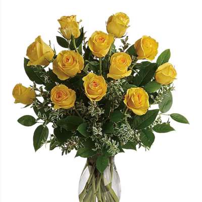 Yellow roses arranged in a clear glass vase
