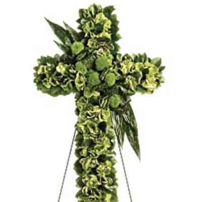 Green floral cross on a metal stand