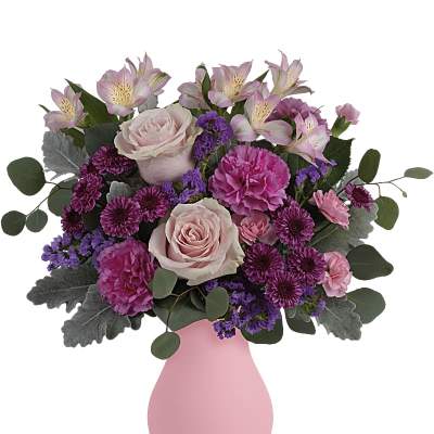 Pink and purple mixed bouquet in a pink vase