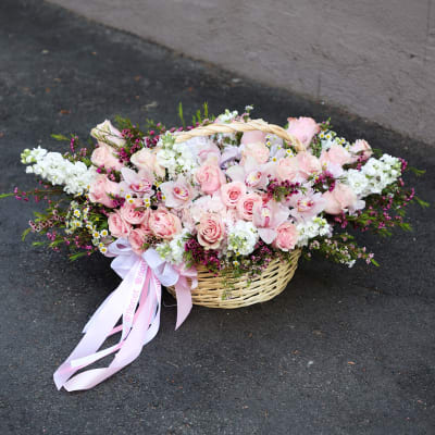 Pink and white flower basket with ribbon bow