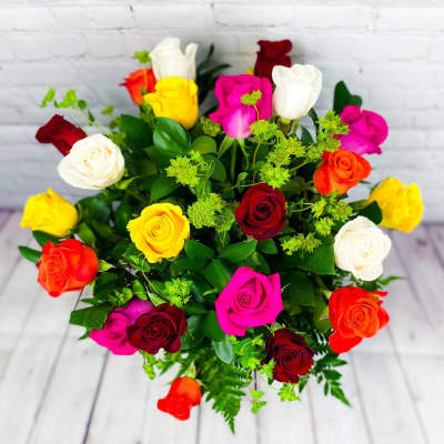 Bouquet of multicolored roses with green filler