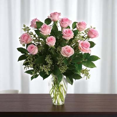 Pink roses arranged in a clear glass vase