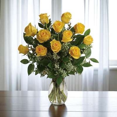 Yellow roses arranged in a clear glass vase