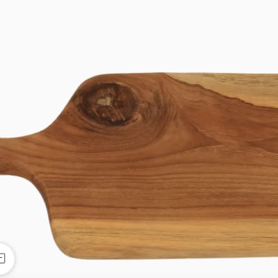Wooden serving board with a rounded handle and natural grain