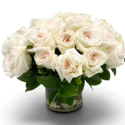 White rose bouquet in a clear glass vase