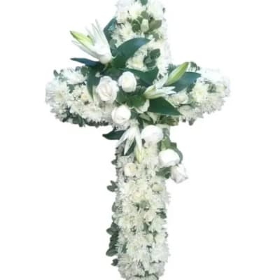White floral cross arrangement with lilies and roses