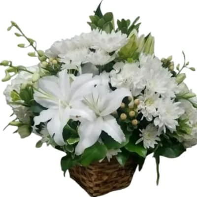 White lilies and chrysanthemums in a woven basket