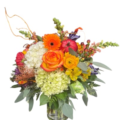 Colorful mixed flower arrangement in a glass vase