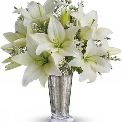 White lilies arranged in a silver vase
