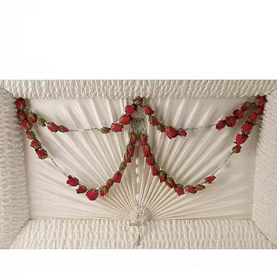 White casket spray with red rose garlands